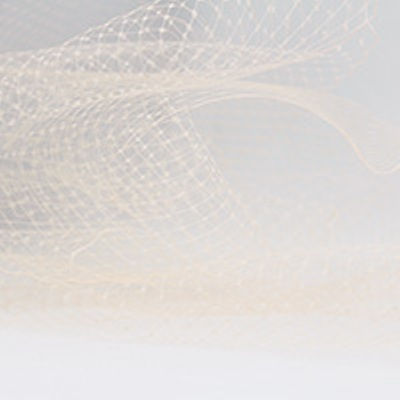 peach nylon hat netting scalloped on both edges 9 inches wide