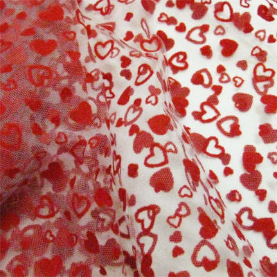 white polyester tulle with red flocked heart