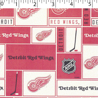 NHL medium weight polyester fleece in a block print of detroit red wings in white and red
