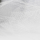 ivory  nylon hat netting scalloped on both edges 9 inches wide