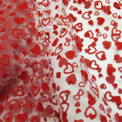 white polyester tulle  with red flocked heart 