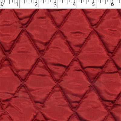 red polyester diamond quilt stain. Acetate lining Face, Polyester fill, and Polypropylene back