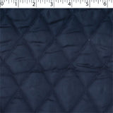 navy polyester diamond quilt stain. Acetate lining Face, Polyester fill, and Polypropylene back