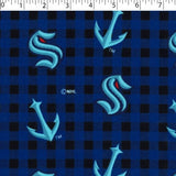 medium weight brushed NHL cotton in the print of Seattle Kraken on a blue and black buffalo check background