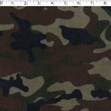A camouflage print in brown and green shades on a chenille fabric base