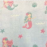aqua heavy weight double sided chenille with glow in the dark mermaids on one side