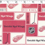 NHL medium weight polyester fleece in a block print of detroit red wings in white and red