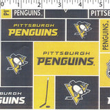 NHL medium weight polyester fleece in a block print of pittsburgh penguins in black and yellow