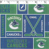 NHL medium weight polyester fleece in a block print of vancouver canucks in blue and green