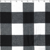 medium weight cotton yarn dye brushed plaids in the design of large buffalo check ivory and black