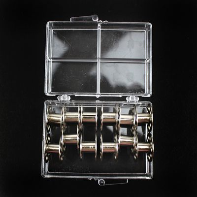 12 REUSABLE METAL BOBBINS IN PLASTIC CASE